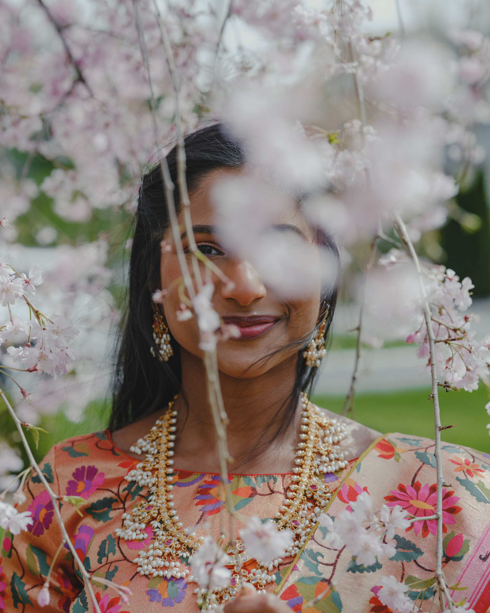 Bride portrait photography of amidst the cherry blossoms during a wedding in Parsippany-Troy Hills, New Jersey