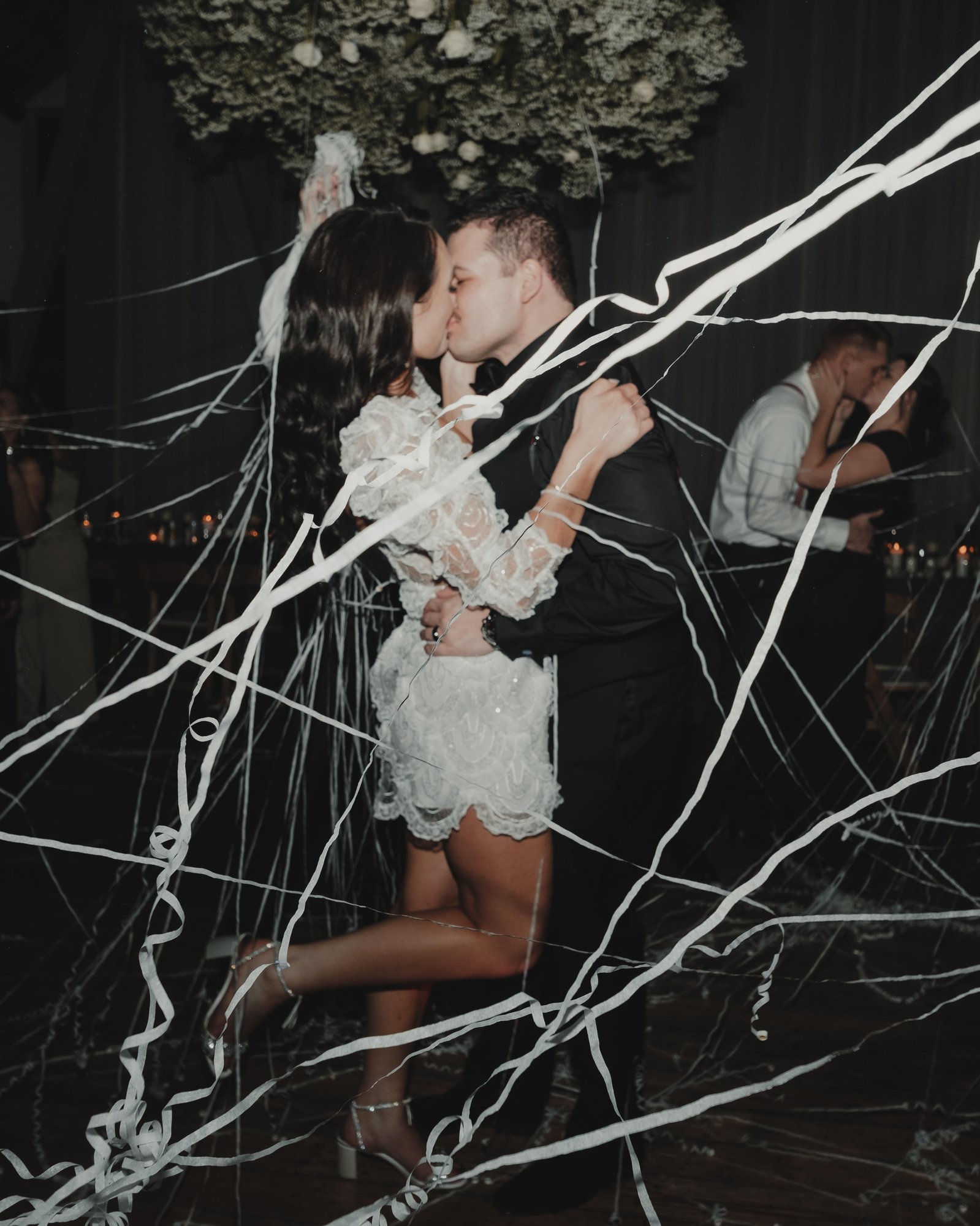 A midnight kiss for the newlyweds during a New Year's Eve wedding in Seattle, Washington.