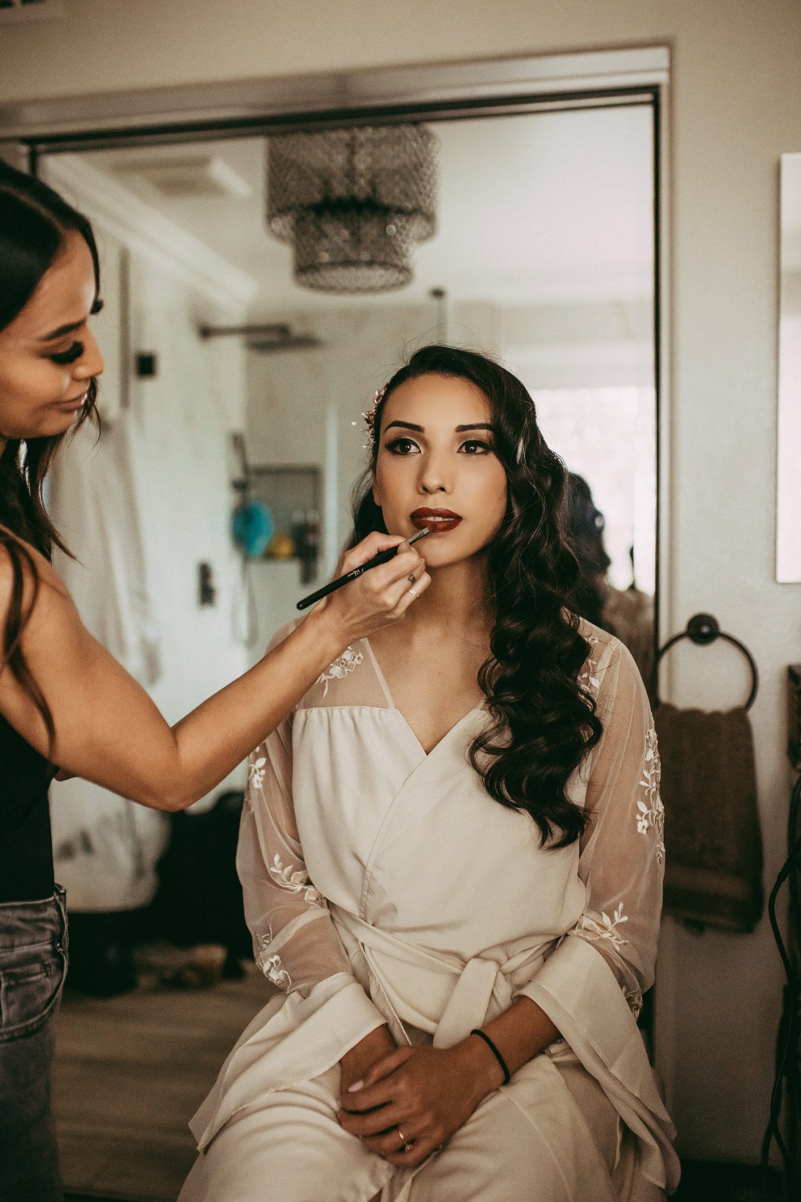 Bride getting her makeup touchups