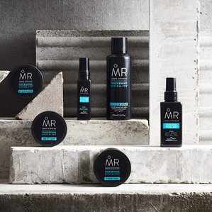 Range of Mr Jamie Stevens thickening range standing on concrete shapes. Photographed and styled by cosmetic photographer Tom Hargreaves in his studio in Exeter, Devon