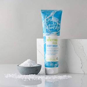KindNatured sea salt &amp;amp;amp; bergamot bodywash next to small dish of sea salt and marble tile. Photographed and styled by cosmetic photographer Tom Hargreaves in his studio in Exeter, Devon