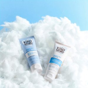 Kindnatured Coconut milk and cotton sleep cream and daily moisturiser lying in cloud of cotton. Photographed and styled by cosmetic photographer Tom Hargreaves in his studio in Exeter, Devon