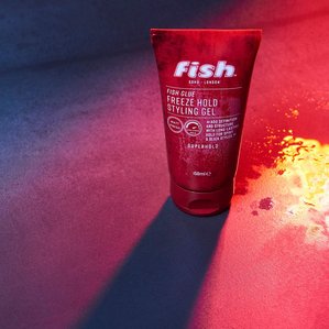 Fish Soho freeze hold styling gel with strong backlight creating a long shadow. Photographed and styled by cosmetic photographer Tom Hargreaves in his studio in Exeter, Devon