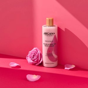 Argan+ Rose Calm & soothe bath foam with rose petals. Photographed and styled by cosmetic photographer Tom Hargreaves in his studio in Exeter, Devon