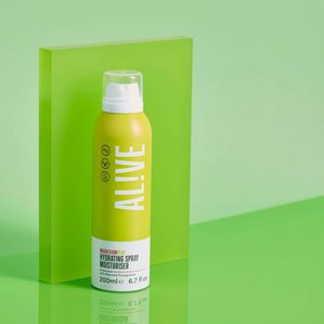 Alive magnesium plus hydrating spray moisturiser standing in front of green acrylic block and green backdrop. Photographed and styled by cosmetic photographer Tom Hargreaves in his studio in Exeter, Devon