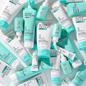 Superfacialist clear skin range laid out in a styled messy layout. Photographed and styled by cosmetic photographer Tom Hargreaves in his studio in Exeter, Devon