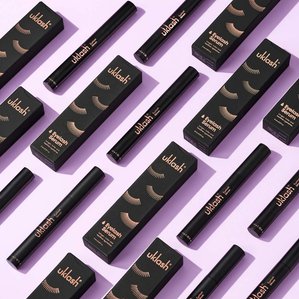Repetitive pattern of Uklash Eyelash serums on lilac backdrop. Photographed and styled by cosmetic photographer Tom Hargreaves in his studio in Exeter, Devon