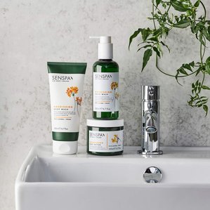 Senspa Nourishing range of Hand wash, body wash and body butter in bathroom scene on bathroom sink. Photographed and styled by cosmetic photographer Tom Hargreaves in his studio in Exeter, Devon