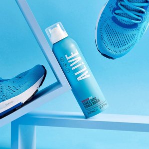 Alive clean &amp;amp; shave shower mousse, propped with matching blue running trainers. ​Photographed and styled by cosmetic photographer Tom Hargreaves in his studio in Exeter, Devon