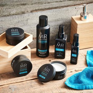Mr Jamie Stevens thickening range in a wooden themed bathroom setting. Photographed and styled by cosmetic photographer Tom Hargreaves in his studio in Exeter, Devon