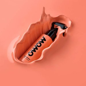 OWOW smoothing product being dropped into matching colour paint. Photographed and styled by cosmetic photographer Tom Hargreaves in his studio in Exeter, Devon