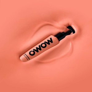 OWOW smoothing product being dropped into matching colour paint. Photographed and styled by cosmetic photographer Tom Hargreaves in his studio in Exeter, Devon