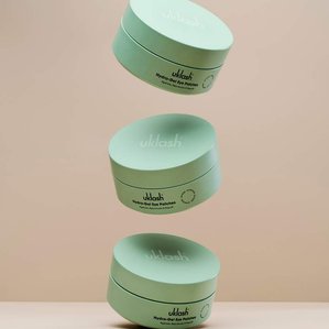 A floating stack of UKlash Hydra-Gel eye patches. Photographed and styled by cosmetic photographer Tom Hargreaves in his studio in Exeter, Devon