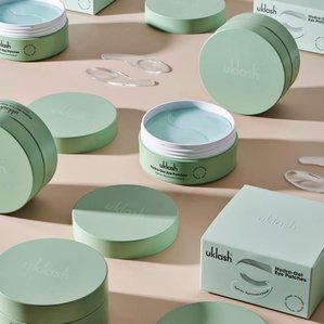 Multiple UKlash Hydra-gel eye patches boxes and tubs. Photographed and styled by cosmetic photographer Tom Hargreaves in his studio in Exeter, Devon