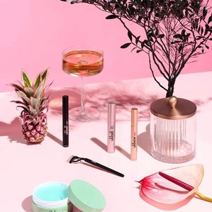 Range of Uklash products within mix of props and plants. Photographed and styled by cosmetic photographer Tom Hargreaves in his studio in Exeter, Devon