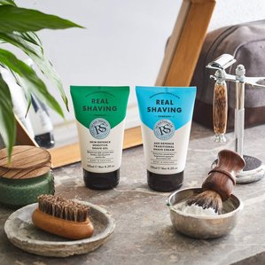 The real shaving company shaving gel and cream in a bathroom shelf setup. Photographed and styled by cosmetic photographer Tom Hargreaves in his studio in Exeter, Devon