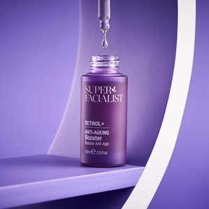 Superfacialist retinol+ Anti-ageing booster with dripping pipette from above. Photographed and styled by cosmetic photographer Tom Hargreaves in his studio in Exeter, Devon