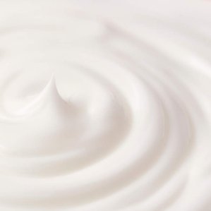 closeup of whipped face cream inn circular spiral shape. Photographed and styled by cosmetic photographer Tom Hargreaves in his studio in Exeter, Devon