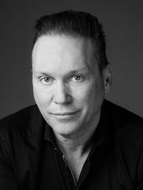 Individual corporate portrait of  man, in black and white 