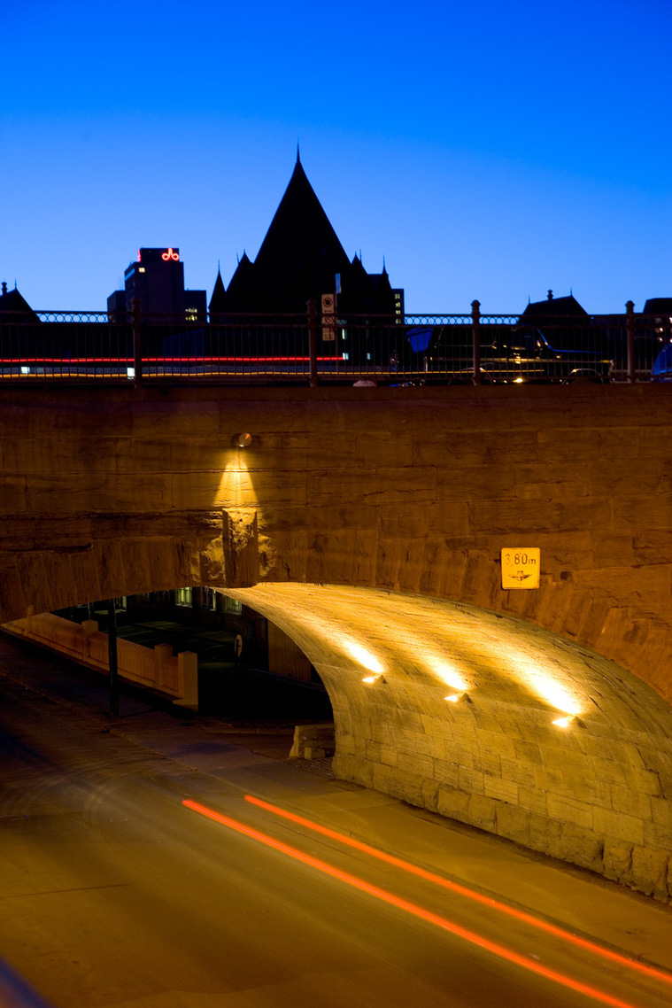 Overpass and old building in Old Montreal night photo