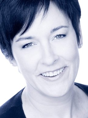 Individual corporate portrait of a woman, in black and white with a blue cast