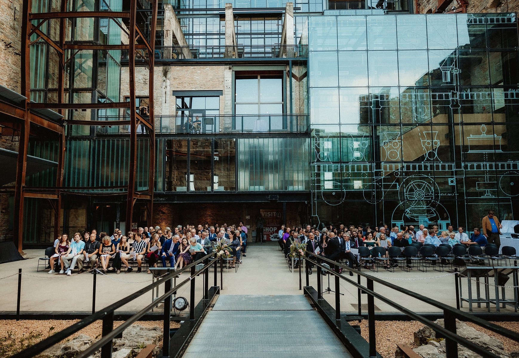 This is a photo of an outdoor wedding at the Mill City Museum in Minneapolis, Minnesota.
