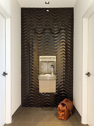 High-quality interior photography by a professional commercial photographer, showcasing a washroom entrance