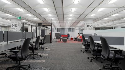 Vibrant coworking space captured by a commercial interior photographer, showcasing a blend of textures and open lounge zones.