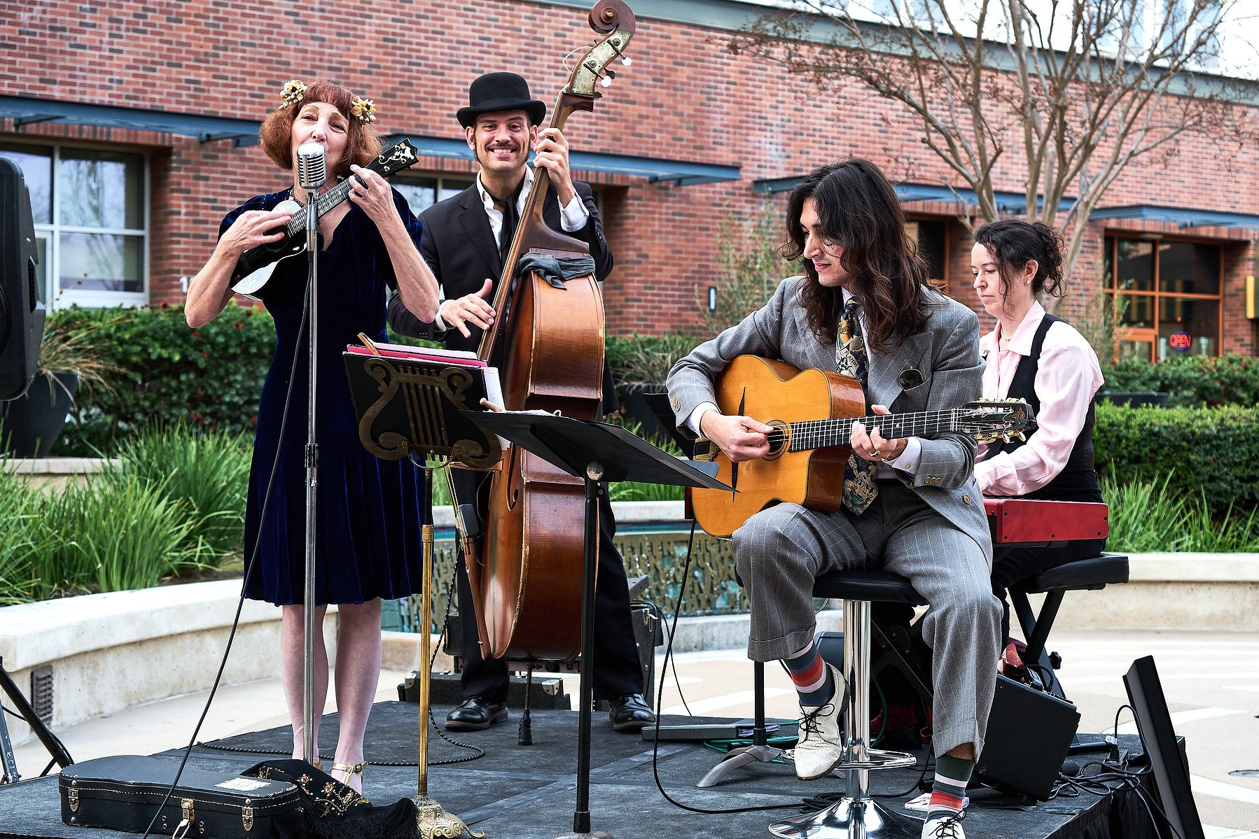A live band performs outside the Carnegie building at Muzeo in Anaheim, CA