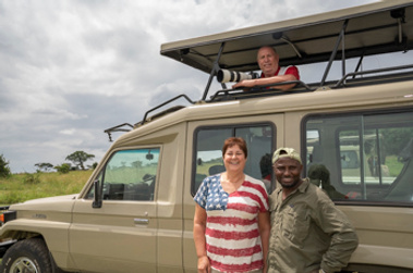 Mike & wife Cindy Jensen with guide Yusuf Ngaina on safari in Africa