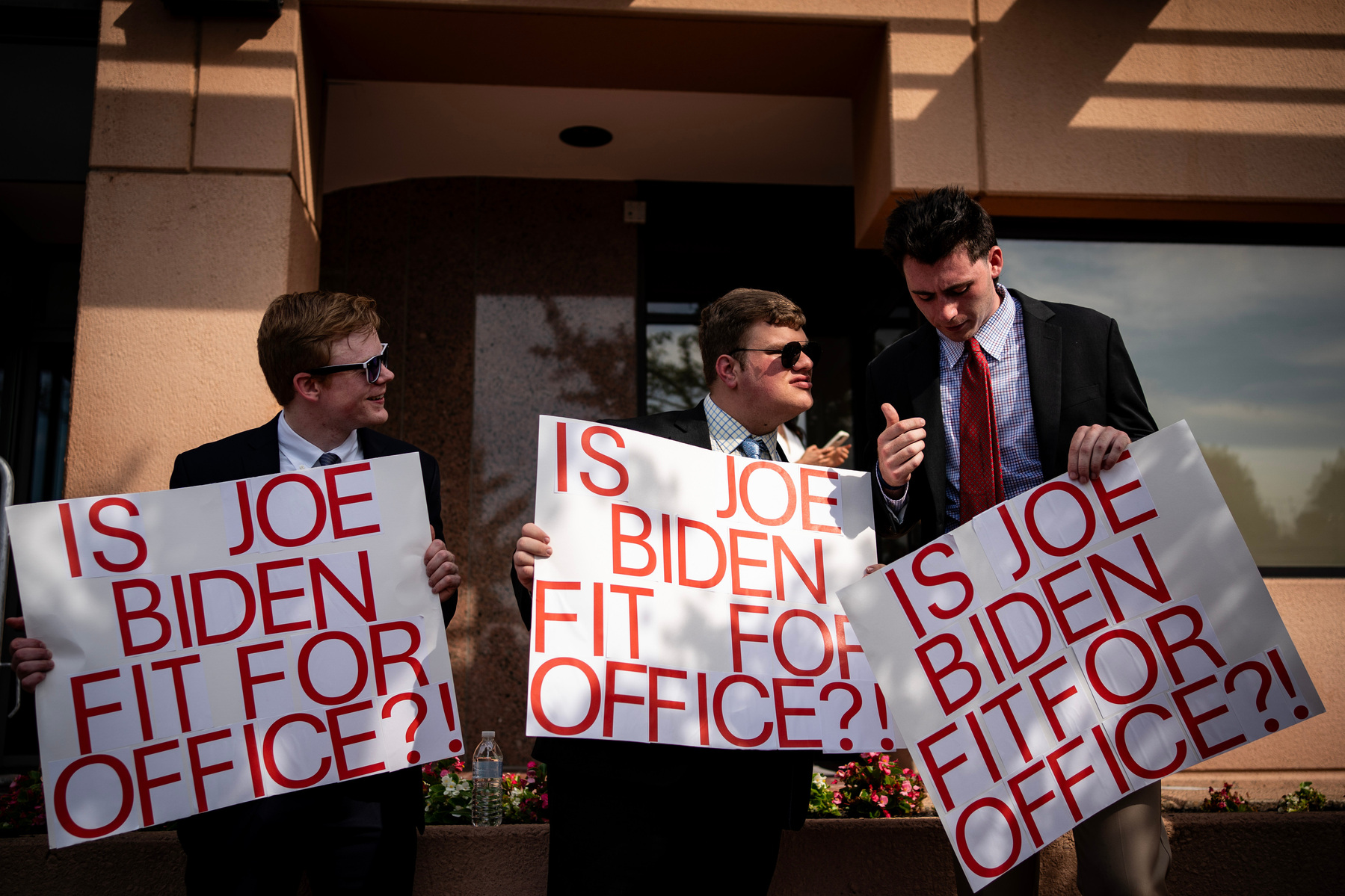 DC-Hill. Three people from National Republican Congressional Committee (NRCC), show signs to House Democratic members as they arrive for a caucus meeting on Tuesday, July 9, 2024. (Photo by Haiyun Jiang for The New York Times)