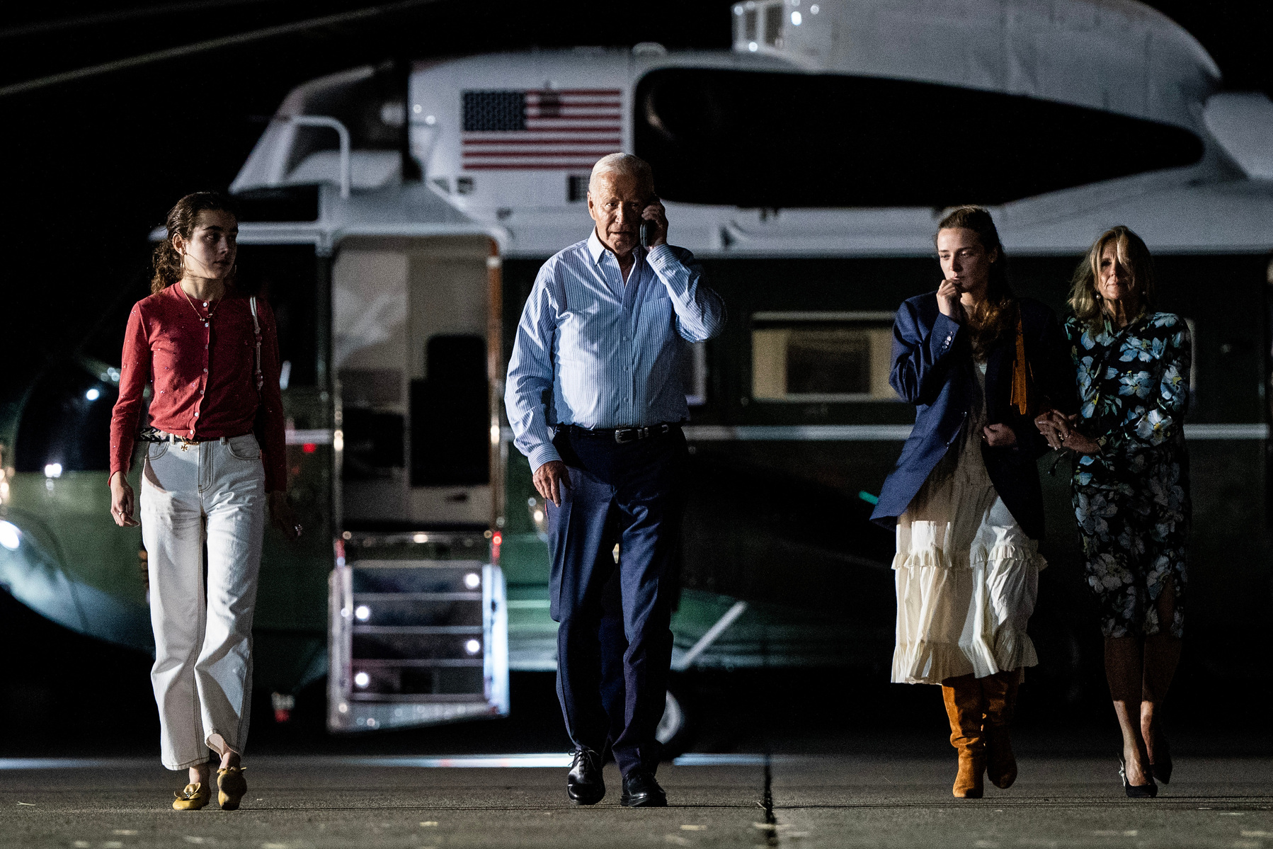 DC-Biden. President Joe Biden talks on the phone as he and First Lady Dr. Jill Biden, with their granddaughters Finnegan and Natalie Biden, depart Burlington County, New Jersey, en route to Hagerstown, Maryland, after campaign receptions in the Hamptons,
