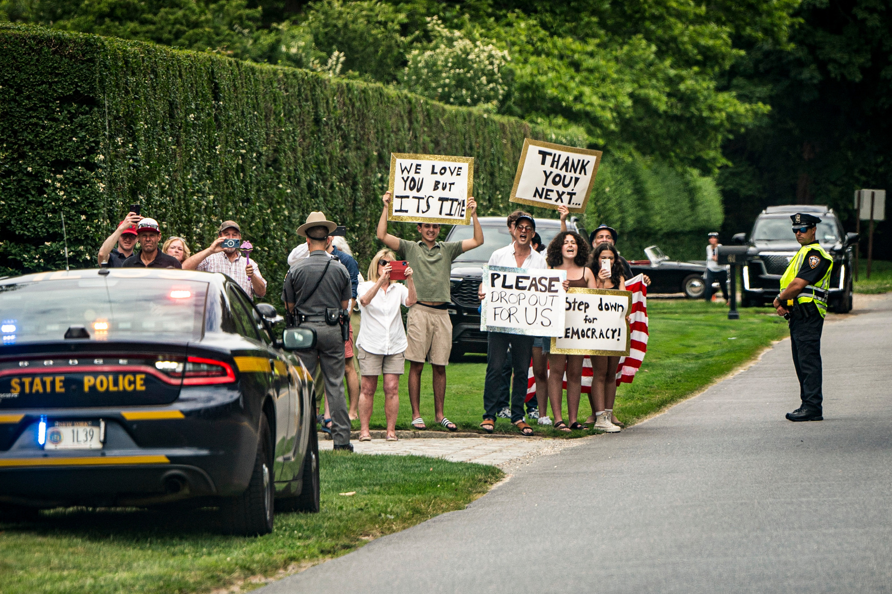 DC-Biden. People hold signs calling for President Joe Biden to step aside this upcoming election in East Hampton, New York, as the motorcade carrying President Joe Biden and First Lady Dr. Jill Biden en route to a campaign reception on Saturday, June 29,