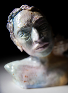 Woman sculpture portrait with seashell on the shoulder