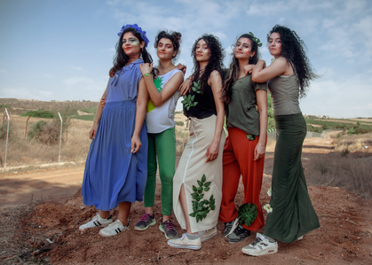Empowering Refugee Women: Fashion Workshop in Greek Camp with Recycled Clothing Redesign lead by artist Anrike Piel
