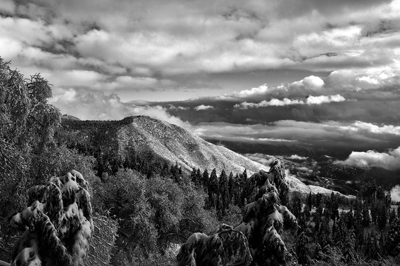 Panoramic mountain view with clouds.