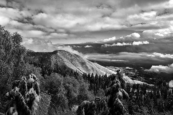 Panoramic mountain view with clouds.
