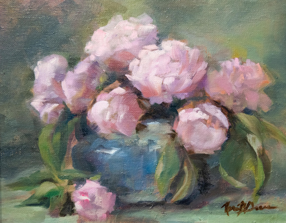 Still life with pink peonies in a blue vase.