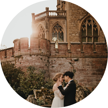 Sunset elopement at Marienburg castle in Germany. Bride and groom are posing for their destination wedding pictures.