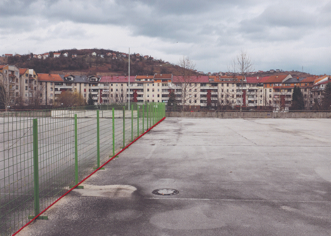 Fence on parking garage roof in Dobrinja represents IEBL in Sarajevo. In 2001, an international arbitrator revised it to address pressing issues.