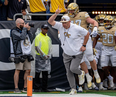 Pictured, Eric Graham photographing the Georgia Tech Football Team in Atlanta, Georgia.
