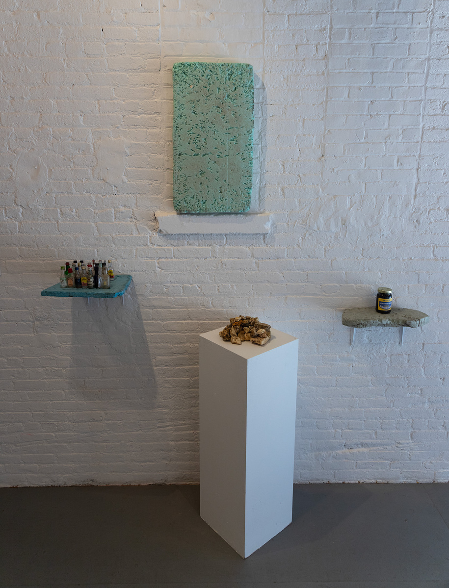 4 works from Priscilla Stadler's SLUDGE art project about Newtown Creek, a toxic waterway dividing Queens & Brooklyn, NYC. Image shows grouping of pieces made with materials found at the Creek.