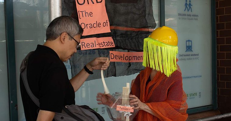Passerby looks at answer received from ORD [ The Oracle of Real-estate Development]