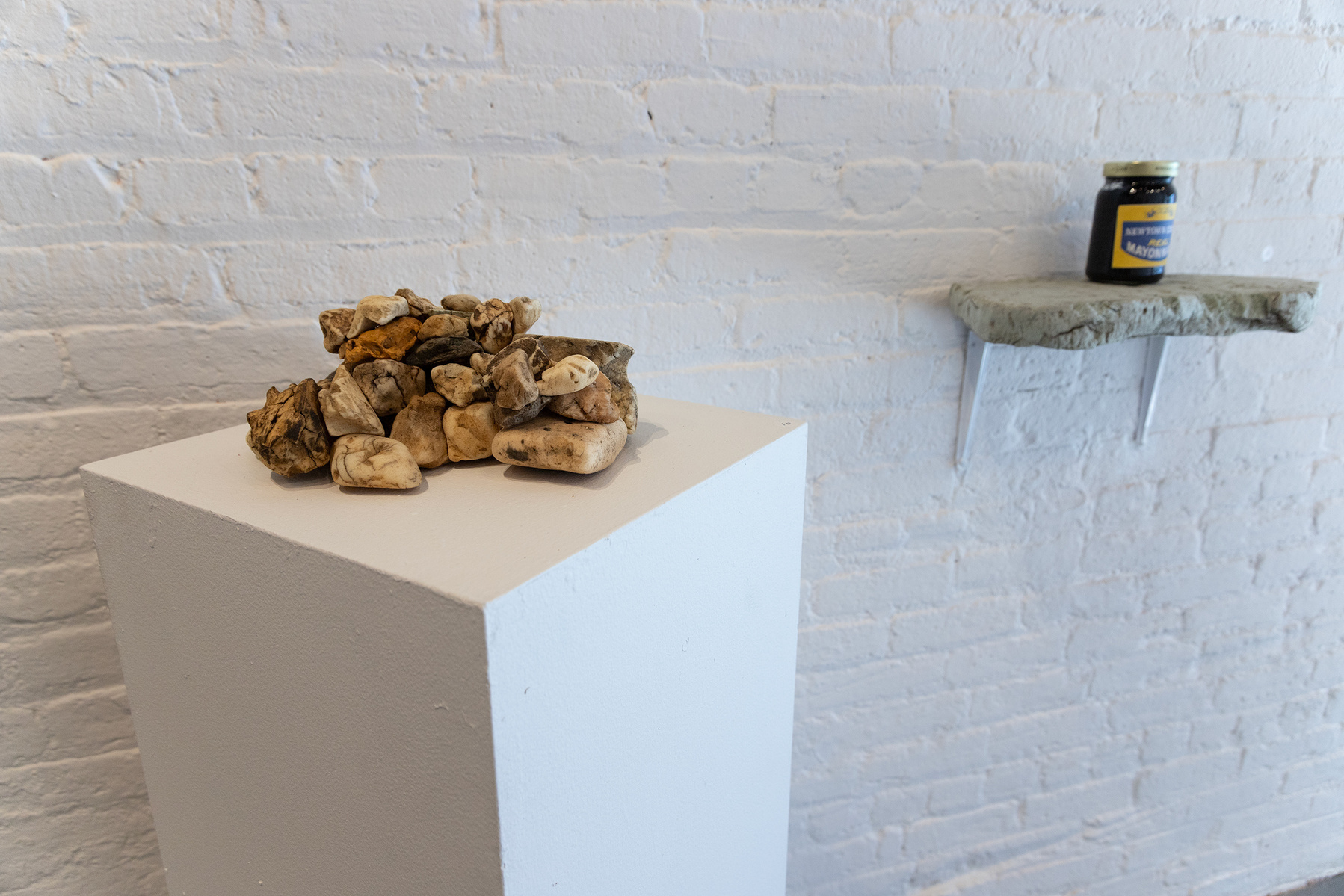 From Priscilla Stadler's SLUDGE art project about Newtown Creek, a toxic NYC waterway. Foreground: "Creek Stones", a pile of weathered pieces of styrofoam, insulation foam etc that look like stones but are not.