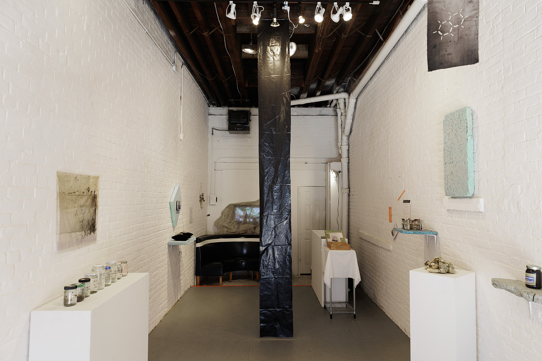 Installation view showing works from Priscilla Stadler's SLUDGE project, an art installation created in response to researching Newtown Creek, a toxic waterway dividing Queens & Brooklyn, NYC. 