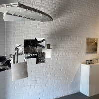 Works from Priscilla Stadler's SLUDGE project, an art installation created in response to researching Newtown Creek, a toxic waterway dividing Queens & Brooklyn, NYC. Left: a sculpture called "Readings"; right: "Troubled Waters 11" (on wall) and "Samples"