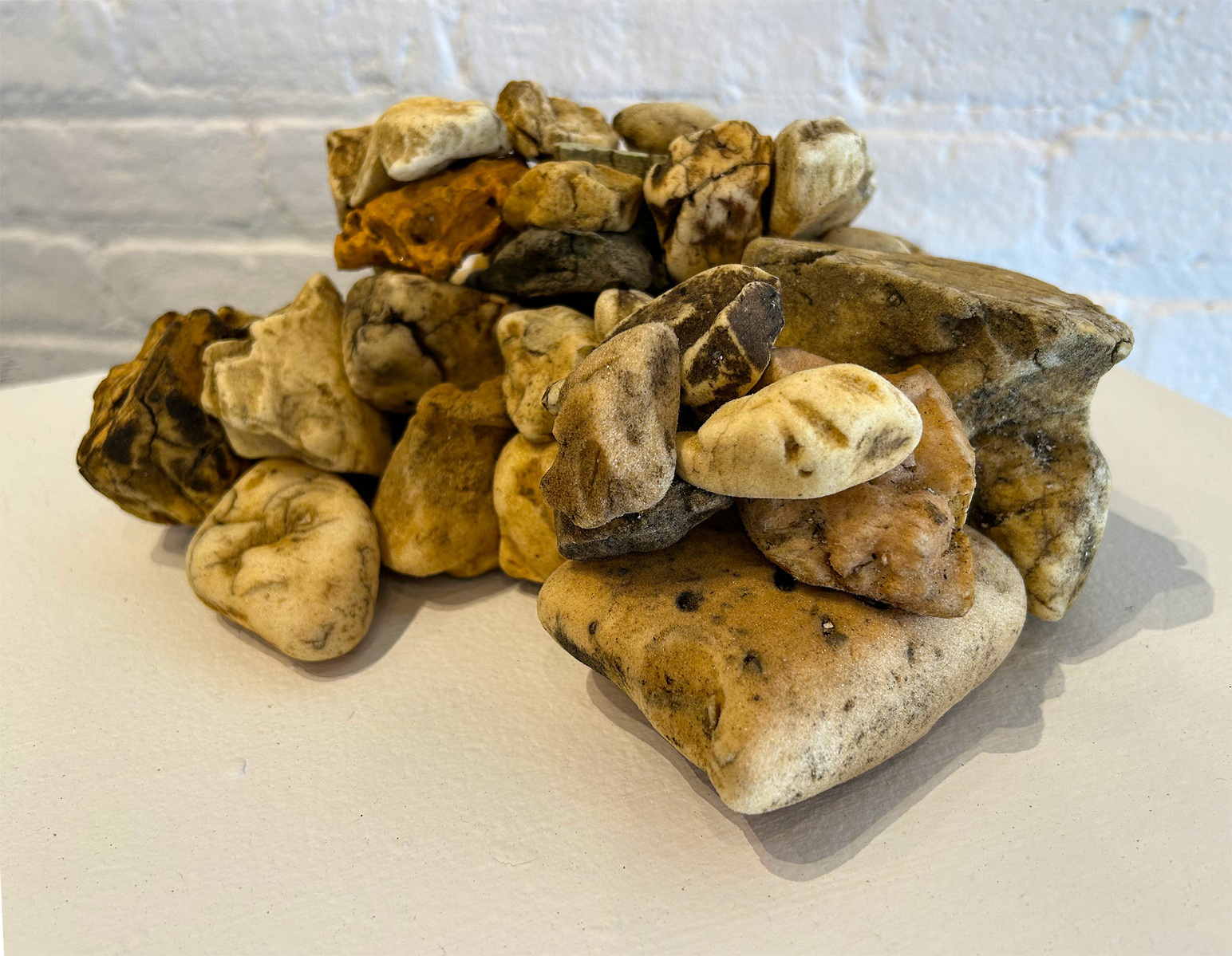 From Priscilla Stadler's SLUDGE art project about Newtown Creek, a toxic NYC waterway. Foreground: "Creek Stones", a pile of weathered pieces of styrofoam, insulation foam etc that look like stones but are not.