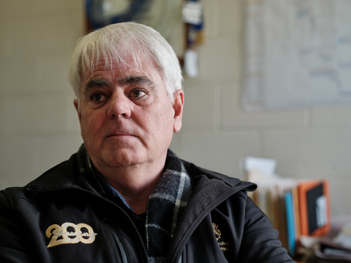 A concerned Scott Gadd talking with Guardian journalist Philippa Duncan in his office.