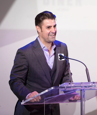 image of a corporate exec presenting at a podium by la event photographer alissa-pagels-minor
