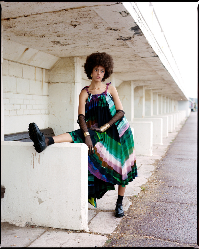 Scarlett Landy pictured wearing ISSEY MIYAKE dress and GRENSON shoes